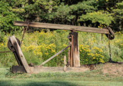 The wooden pumpjacks operate 24 hours a day and blend into the landscape.