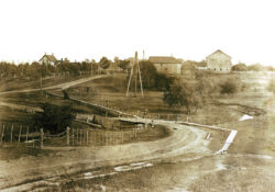 The entrance to Fairbank Oil is largely unchanged from this photo circa 1905, though the trees and barns were replaced.