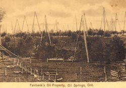This undated postcard of the Fairbank property shows a forest of three-pole derricks and the jerker-line system.